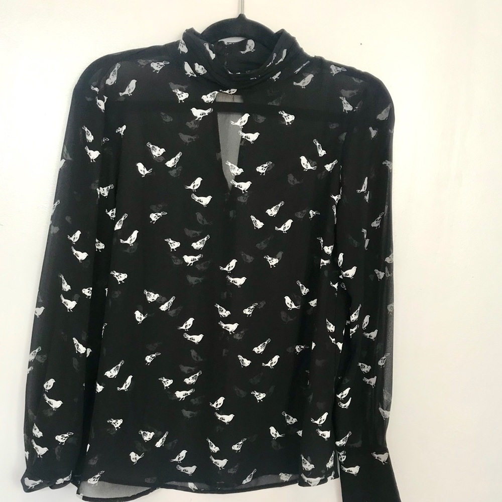 Black sheer top with white birds